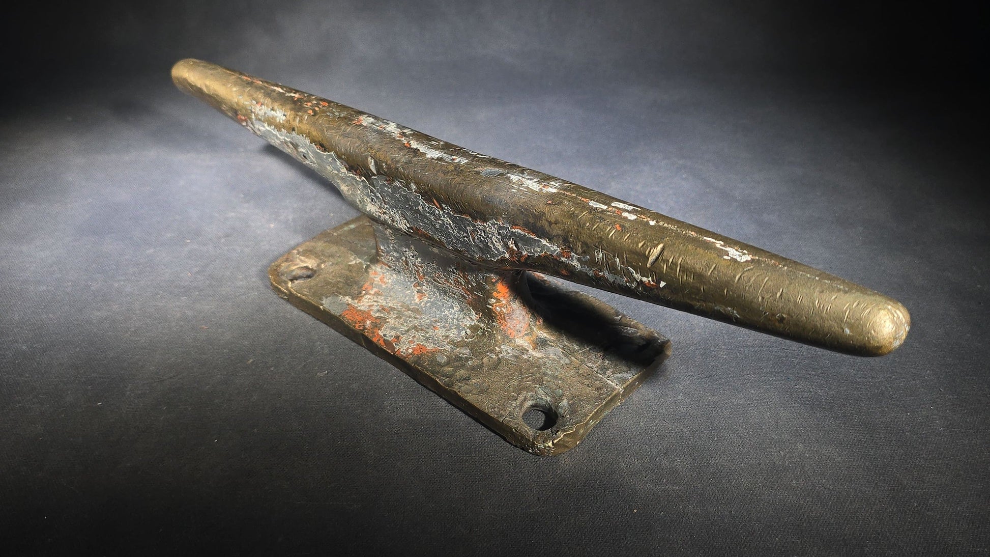 Vintage Bronze Boat Dock Cleat with Layers of Old Paint