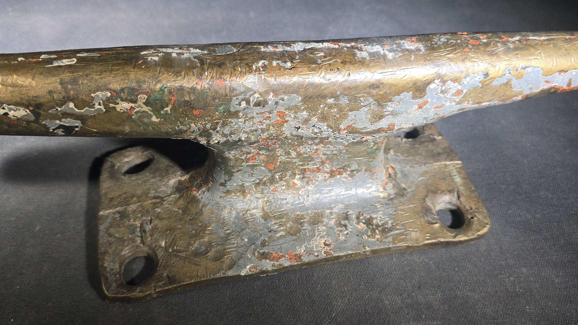 Vintage Bronze Boat Dock Cleat with Layers of Old Paint