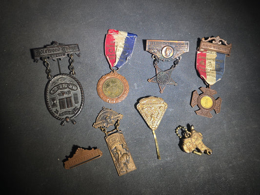 Grouping of Eight Antique Fraternal and G.A.R. Medals, Badges, and Accessories including I.O.O.F. Idlewool Lodge No. 652, Knights of Pythias Trinity Commandery Augusta, Maine, and G.A.R. Encampment Souvenir Badges