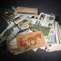 Lot 177 - Discovery Grouping of 75+ Antique and Vintage Postcards Including Gillette Castle, Gardner Largest Chair in the World, Lewiston Bridge at Niagara Falls, Christmas, New Year, and Comic Cards