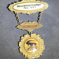 Lot 057 - Antique Independent Order of Odd Fellows I.O.O.F. Stockton Lodge No. 891 Member Medal with All-Seeing Eye and F.L.T. Chain Links, Manufactured by the M.C. Lilley & Co., Columbus, Ohio