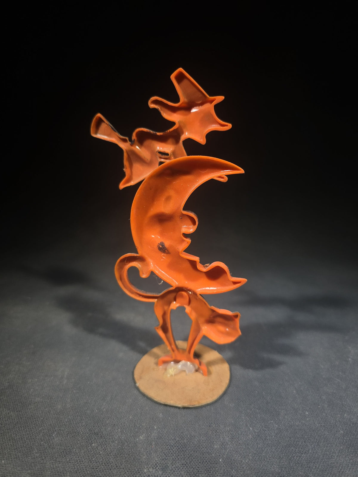 Grouping of Three Vintage Halloween Items including Tin Lithograph Ratchet Noisemaker with Jack-O-Lantern, Black Cat, and Witch Graphics, Manufactured by Kirchhof, Newark, New Jersey, and Two Witch on Crescent Moon and Black Cat Figures