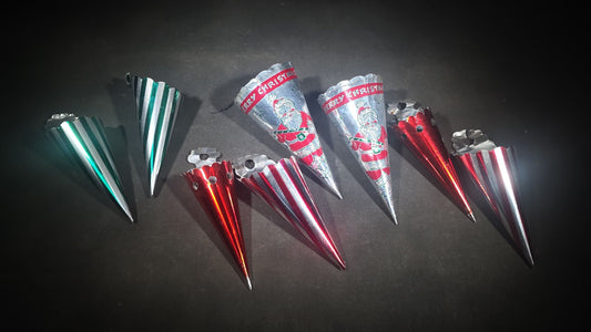 Grouping of Eight Vintage Metal Foil Christmas Candy Horn Ornaments including "Merry Christmas" Santa Claus Cones and Striped Varieties