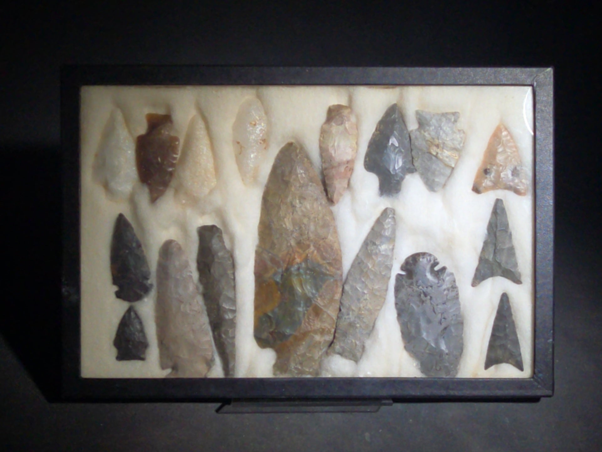 Grouping of 18 Stone Arrowheads and Projectile Points in Riker Display Case