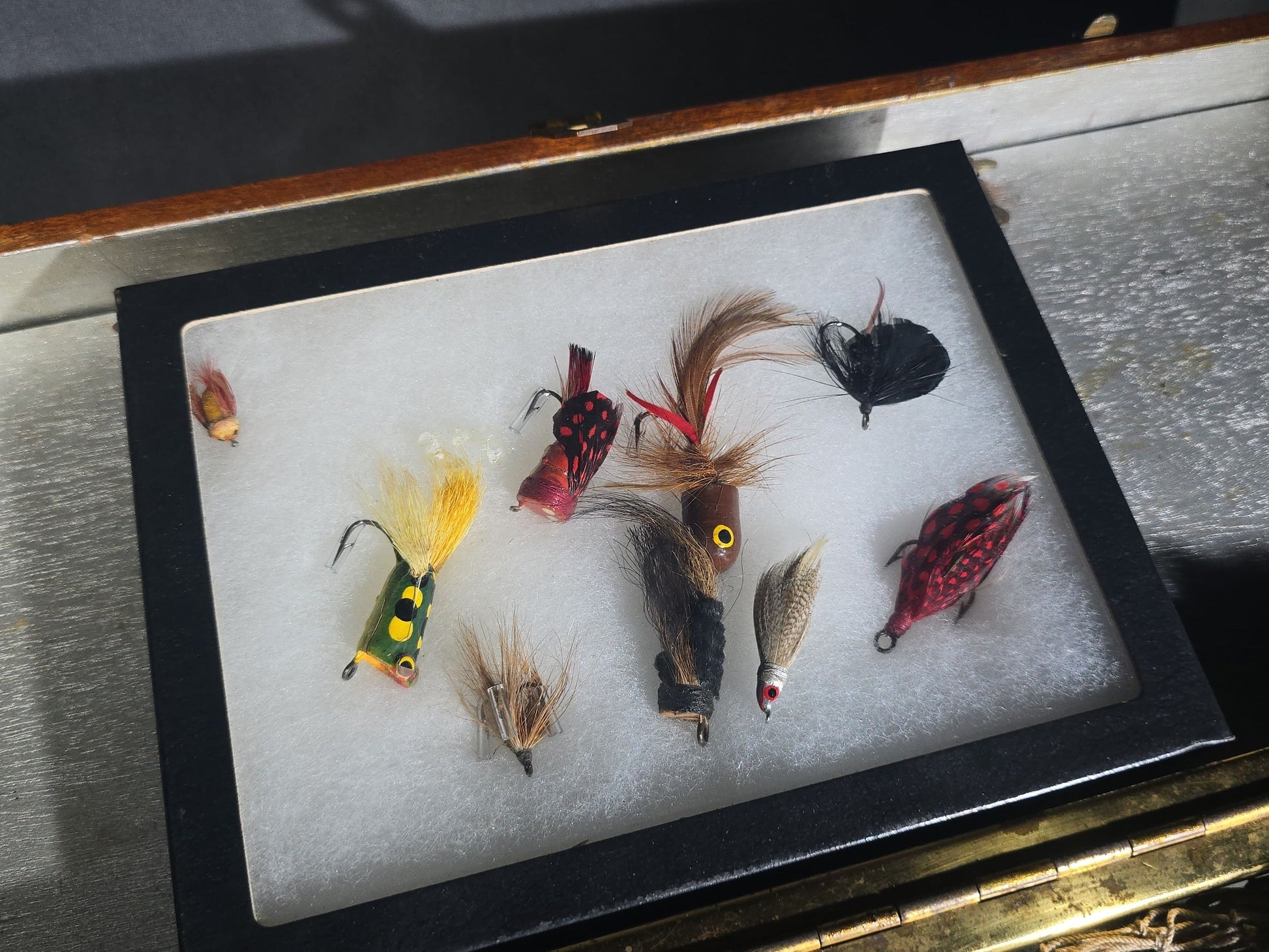 Vintage Wood Tackle Box with Fishing Tackle and Smalls including Creek Chub Bait Co. Injured Minnow Lure, Fly Fishing Flies, Baitcasting Reels, Leader Box, Fly Reel, and Stag Semi-Paste Paint Advertising Miniature Wood Plane
