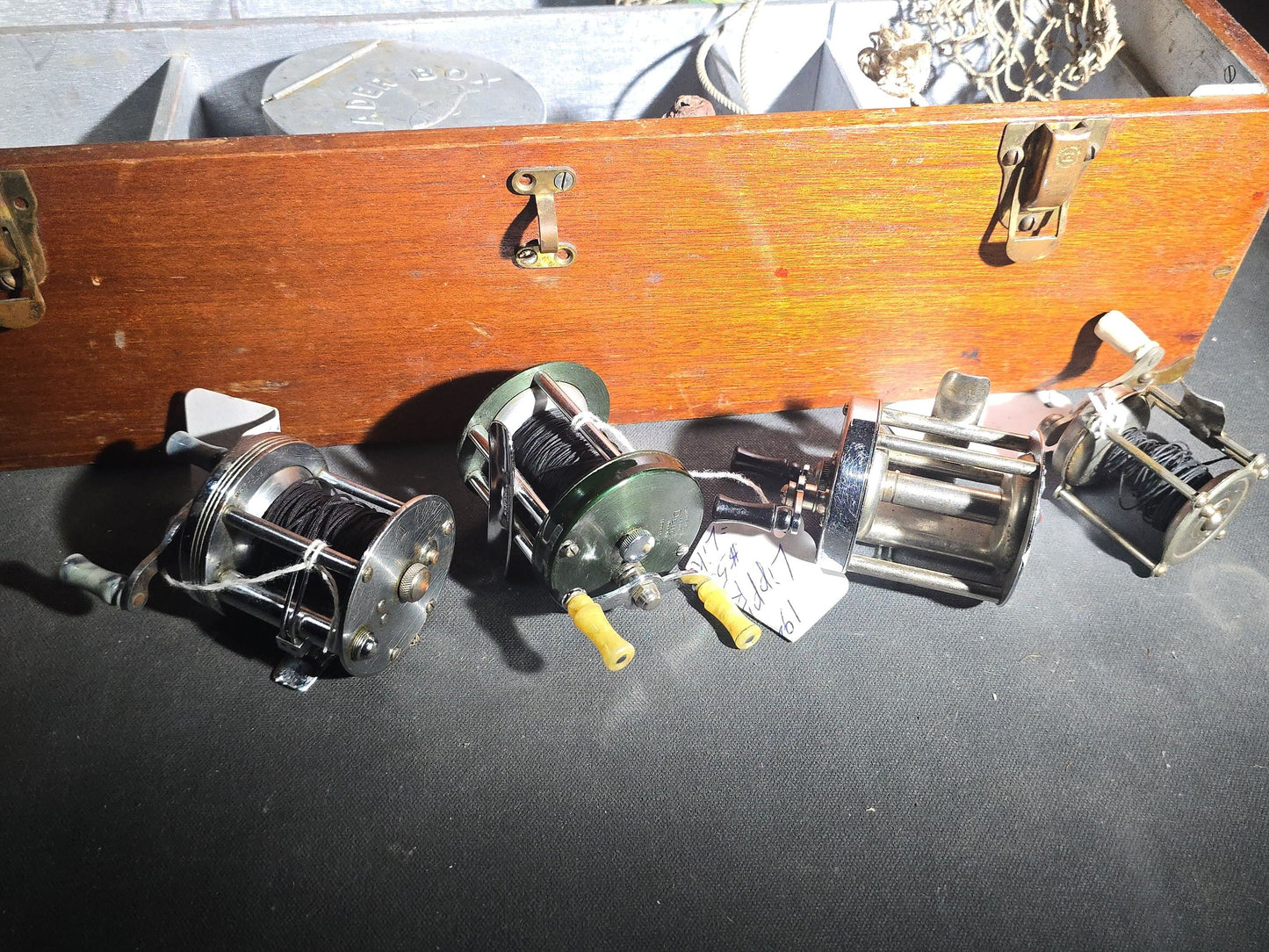 Vintage Wood Tackle Box with Fishing Tackle and Smalls including Creek Chub Bait Co. Injured Minnow Lure, Fly Fishing Flies, Baitcasting Reels, Leader Box, Fly Reel, and Stag Semi-Paste Paint Advertising Miniature Wood Plane