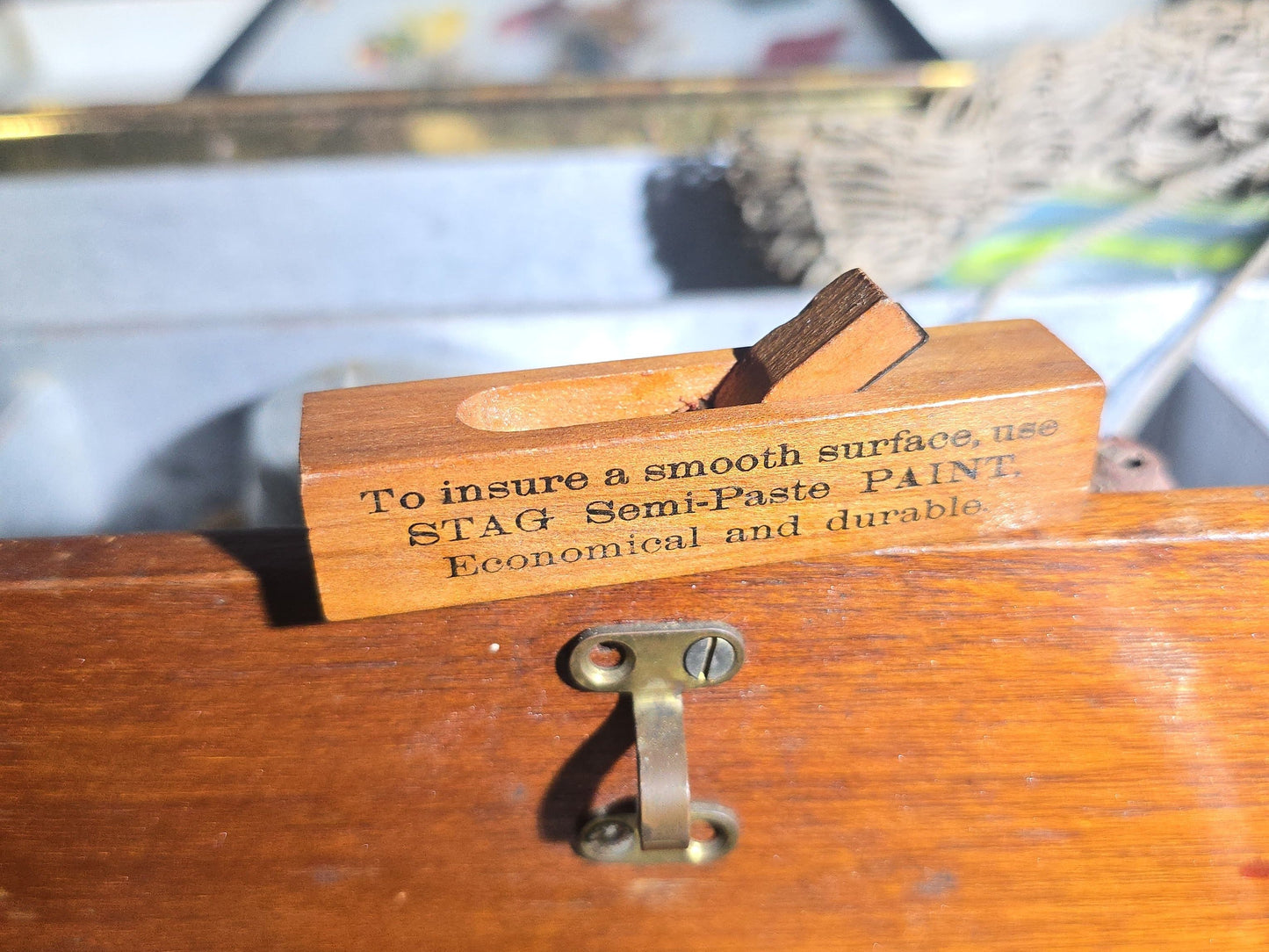 Vintage Wood Tackle Box with Fishing Tackle and Smalls including Creek Chub Bait Co. Injured Minnow Lure, Fly Fishing Flies, Baitcasting Reels, Leader Box, Fly Reel, and Stag Semi-Paste Paint Advertising Miniature Wood Plane