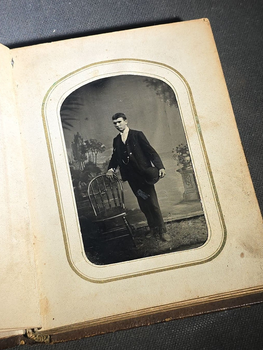 Antique Portrait Photo Album Containing Seven Tintype Photographs and Four C.D.V. Photographs, Embossed Leather Binding