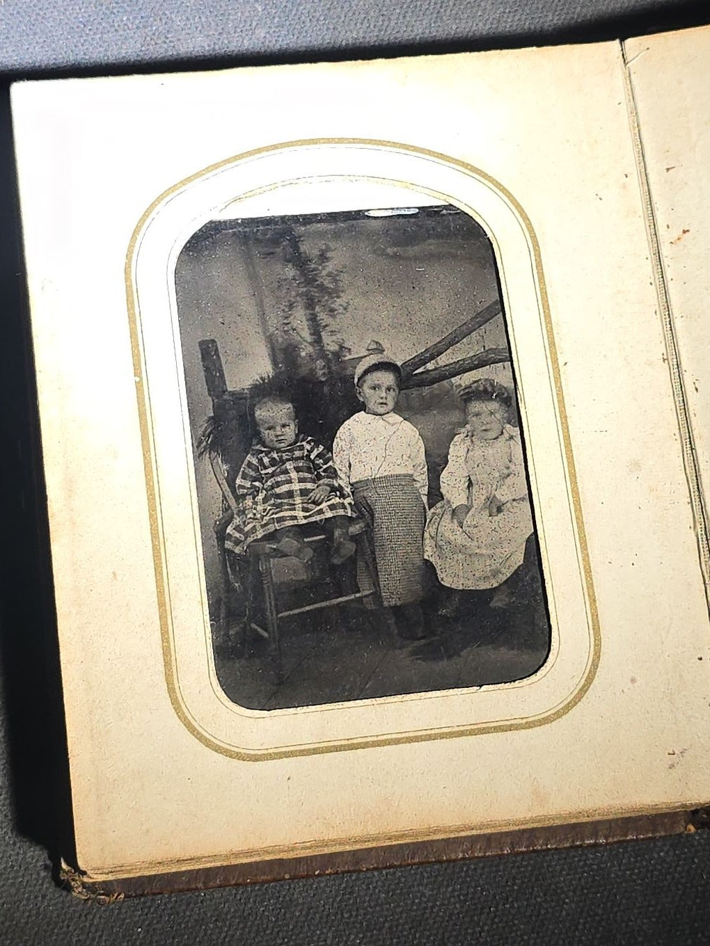 Antique Portrait Photo Album Containing Seven Tintype Photographs and Four C.D.V. Photographs, Embossed Leather Binding