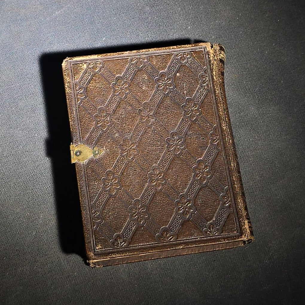 Antique Portrait Photo Album Containing Seven Tintype Photographs and Four C.D.V. Photographs, Embossed Leather Binding