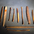 Lot 080 - Grouping of 10 Antique Native American Carved Bone Implements Including Incised and Relief-Carved Examples with Leather Ties and Drilled Holes
