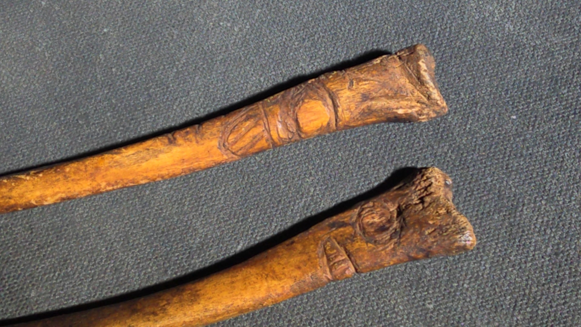 Grouping of 10 Antique Native American Carved Bone Implements including Incised and Relief-Carved Examples with Leather Ties and Drilled Holes