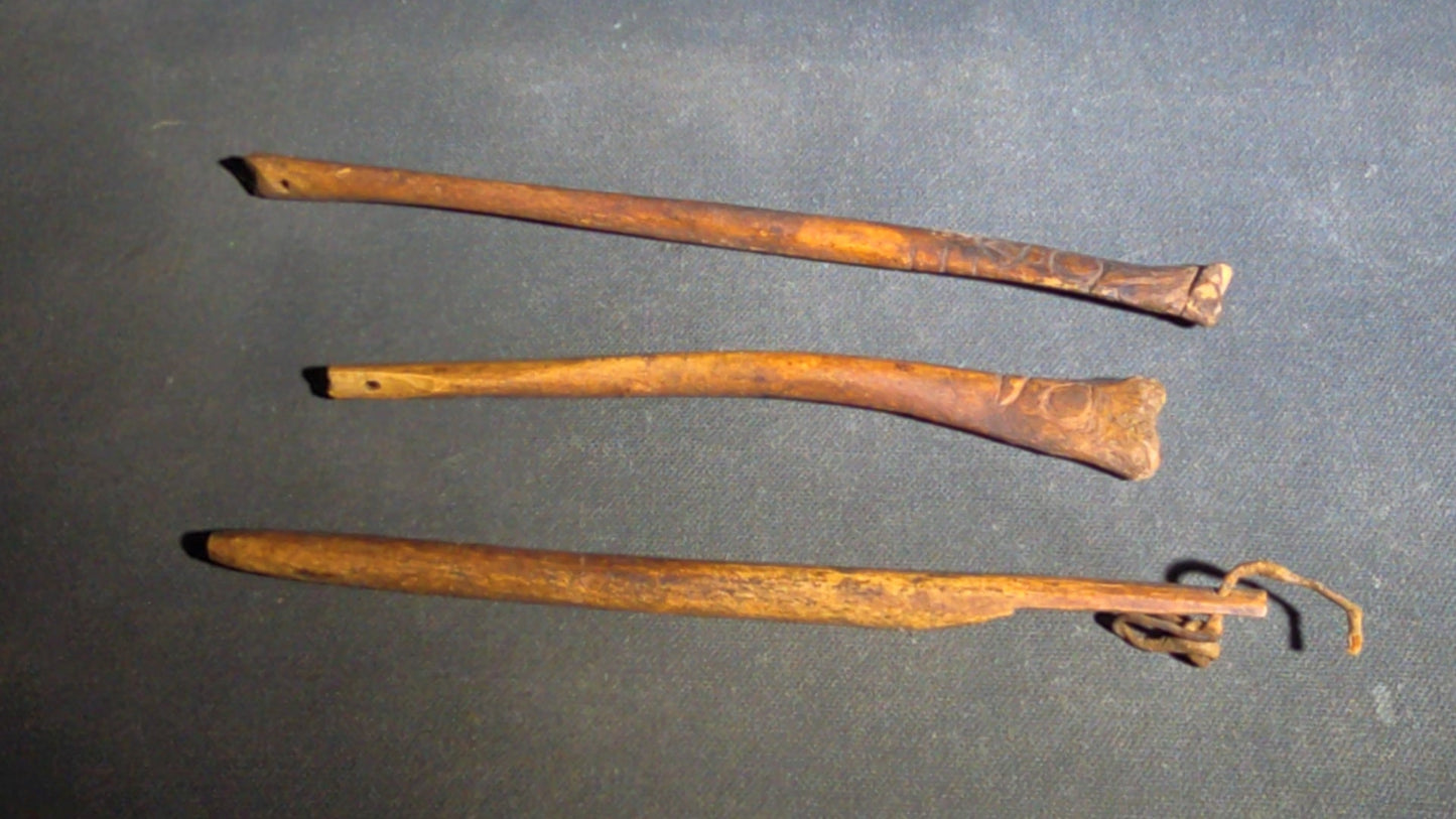 Grouping of 10 Antique Native American Carved Bone Implements including Incised and Relief-Carved Examples with Leather Ties and Drilled Holes