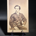 Lot 070 - Antique Carte De Visite C.D.V. Photograph of John Wilkes Booth, Seated Portrait with Cane, Pen-Inscribed Verso