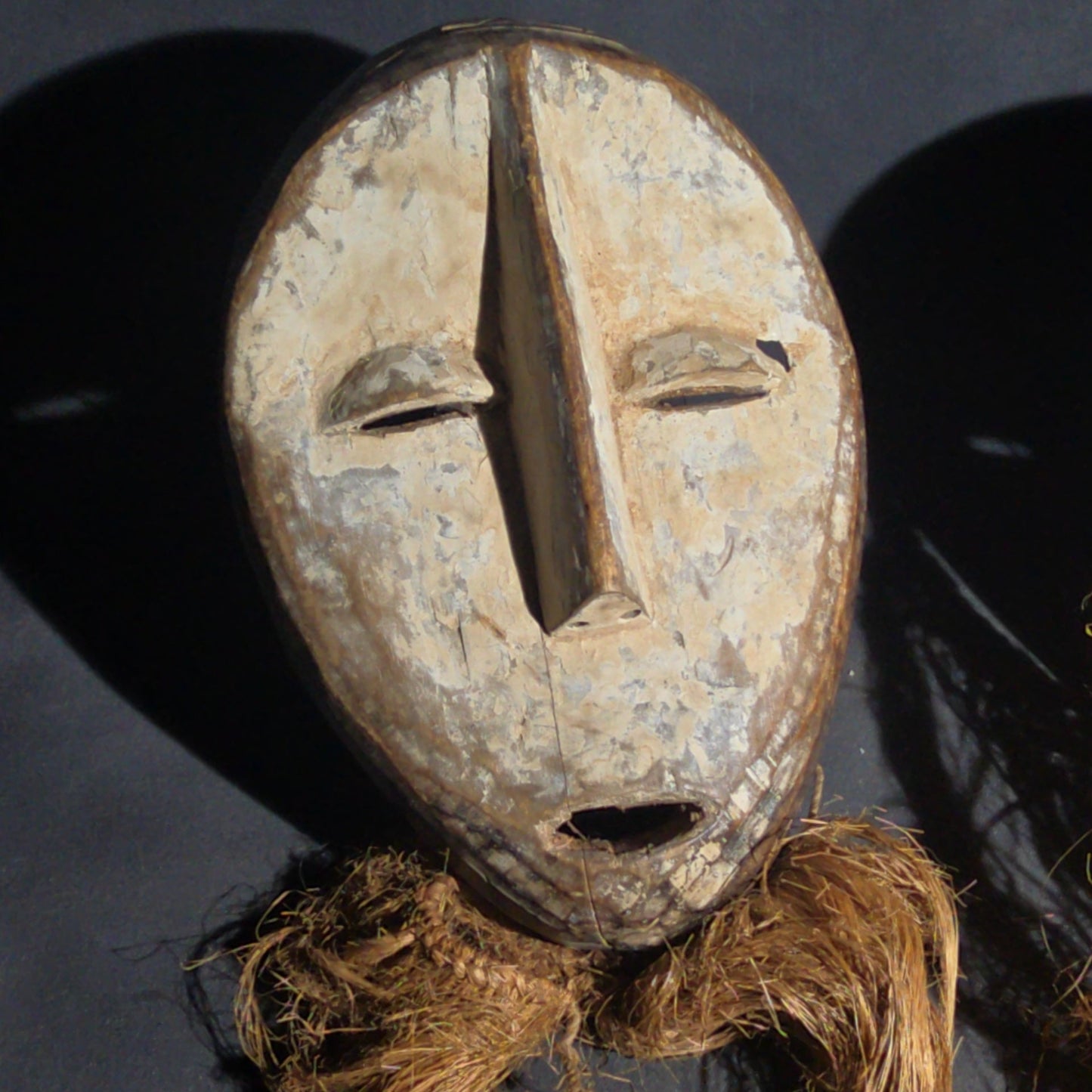 Pair of Vintage Lega Lukwakongo Carved Wood Masks with Raffia Beards, Democratic Republic of the Congo