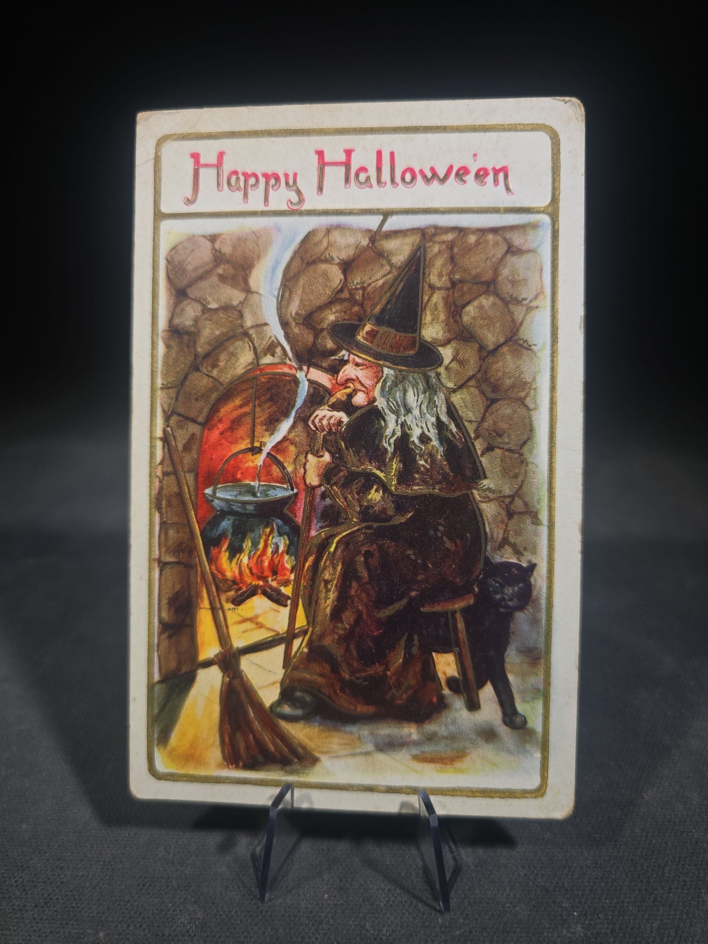 Antique Halloween Postcard with Witch by Fireplace Cauldron, Black Cat, and Broom, "Happy Hallowe'en," Postmarked Massachusetts