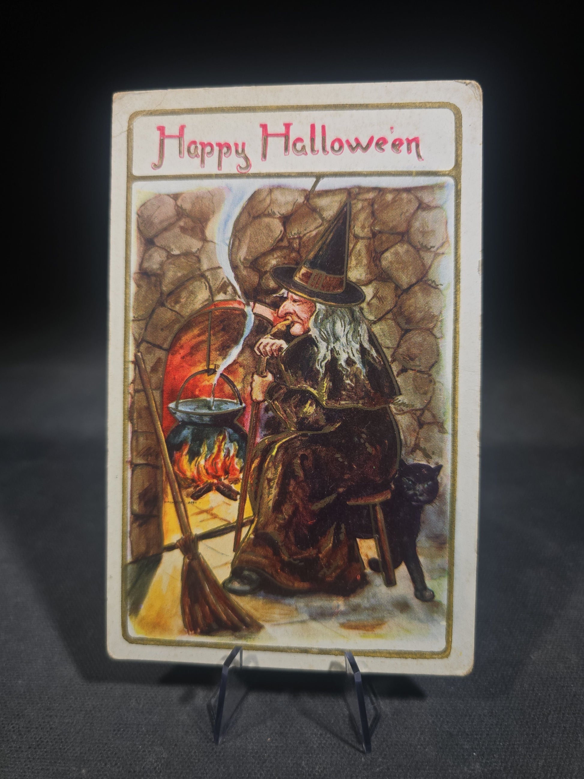 Antique Halloween Postcard with Witch by Fireplace Cauldron, Black Cat, and Broom, "Happy Hallowe'en," Postmarked Massachusetts