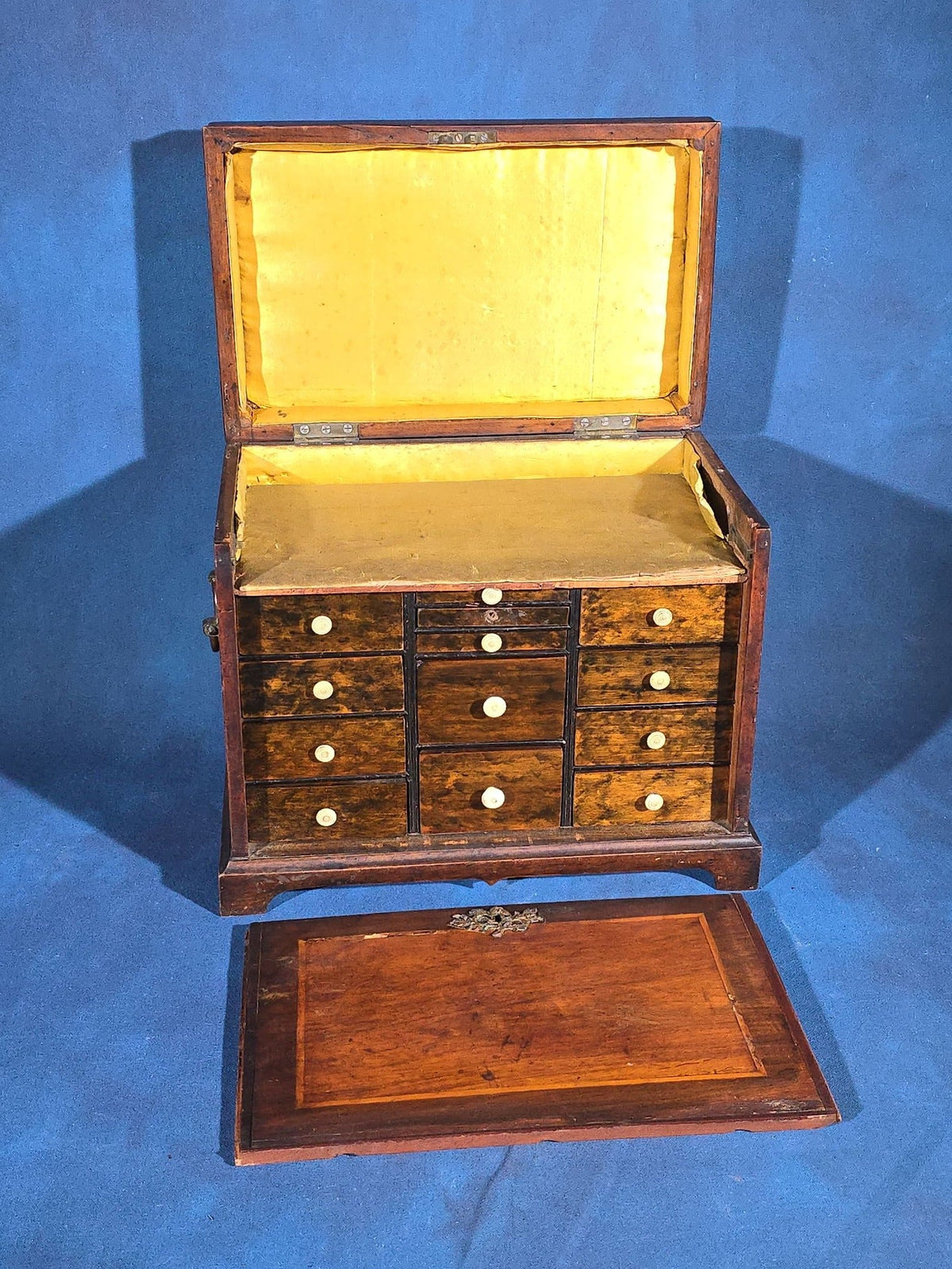 Antique Mahogany Collector's Cabinet with Silk-Lined Interior and Multiple Drawers