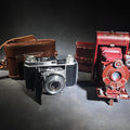 Lot 080 - Pair of Antique and Vintage Kodak Folding Cameras Including No. 1a Pocket Kodak Series II in Red with Kodak Anastigmat Lens and Kodak Retina 35mm Camera with Schneider-Kreuznach Xenar Lens, Compur-Rapid Shutter, and Leather Case