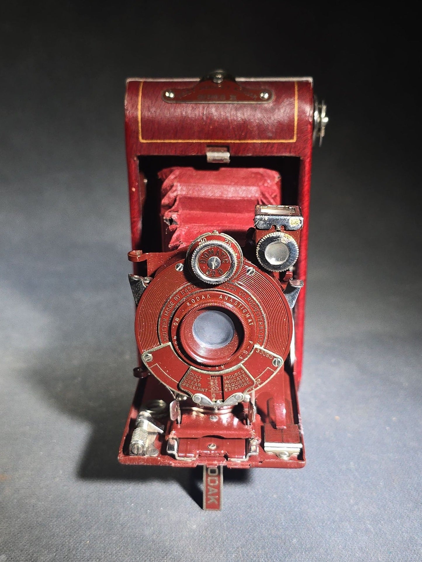 Pair of Antique and Vintage Kodak Folding Cameras including No. 1A Pocket Kodak Series II in Red with Kodak Anastigmat Lens and Kodak Retina 35mm Camera with Schneider-Kreuznach Xenar Lens, Compur-Rapid Shutter, and Leather Case