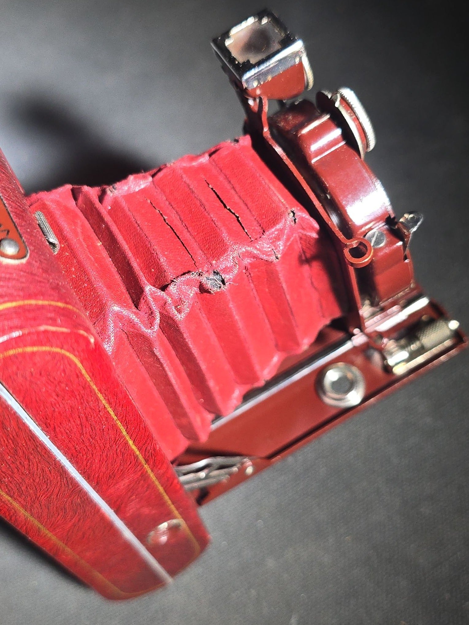 Pair of Antique and Vintage Kodak Folding Cameras including No. 1A Pocket Kodak Series II in Red with Kodak Anastigmat Lens and Kodak Retina 35mm Camera with Schneider-Kreuznach Xenar Lens, Compur-Rapid Shutter, and Leather Case