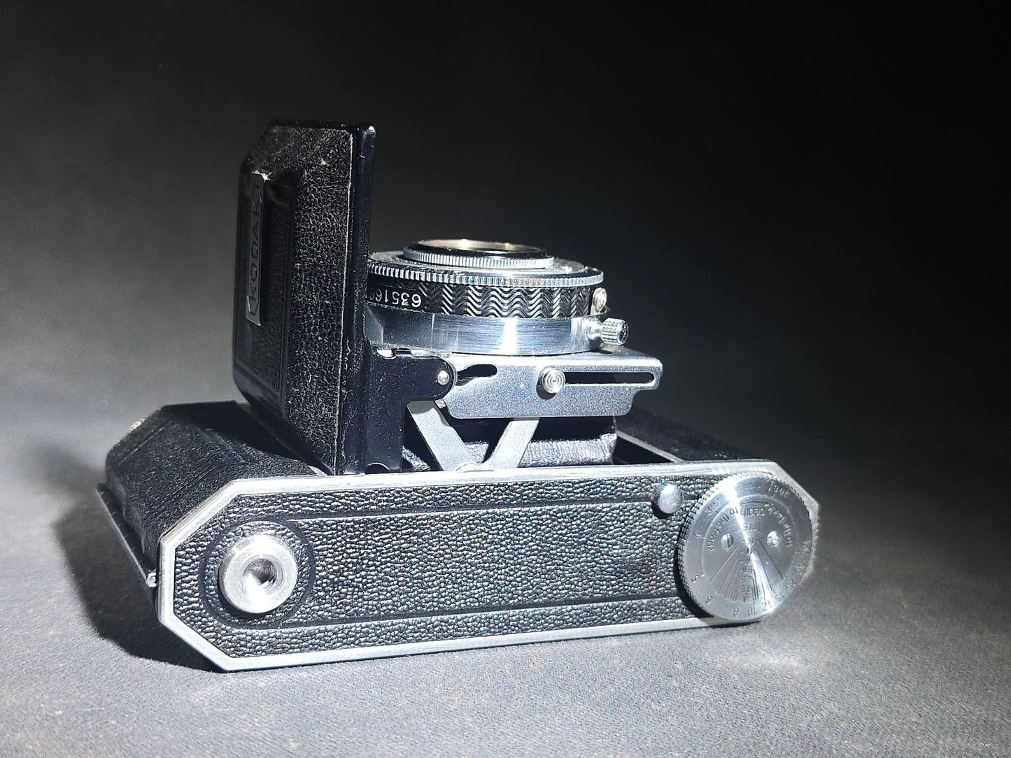 Pair of Antique and Vintage Kodak Folding Cameras including No. 1A Pocket Kodak Series II in Red with Kodak Anastigmat Lens and Kodak Retina 35mm Camera with Schneider-Kreuznach Xenar Lens, Compur-Rapid Shutter, and Leather Case