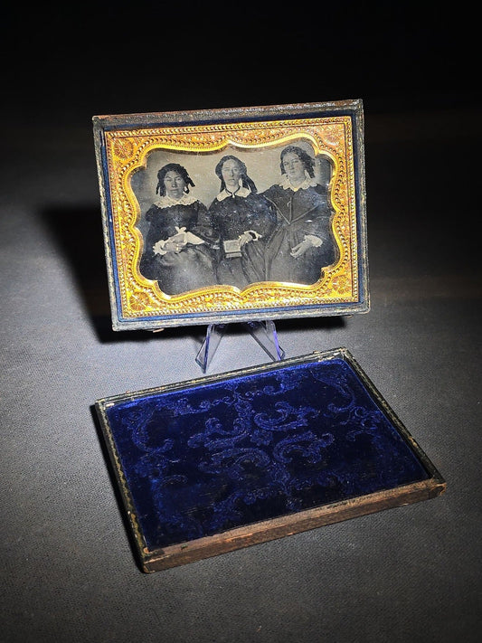 Antique 1/4th Plate Ambrotype Photograph of Three Seated Women, Center Figure Holding a Cased Image, in Full Split Leatherette Case with Blue Pillow