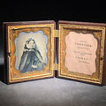 Lot 077 - Antique 1/6th Plate Ambrotype Photograph of a Young Woman in Lace Veil in Thermoplastic Union Case by S. Peck & Co. with Scroll and Oval Lattice Design