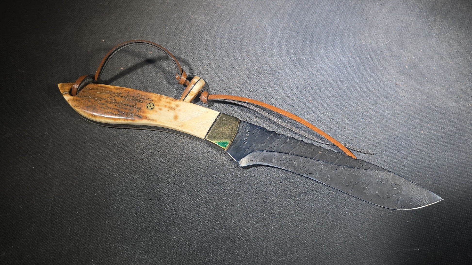 Vintage Damascus Steel Fixed-Blade Knife with Bone Handle, Brass Bolster, and Tooled Leather Sheath