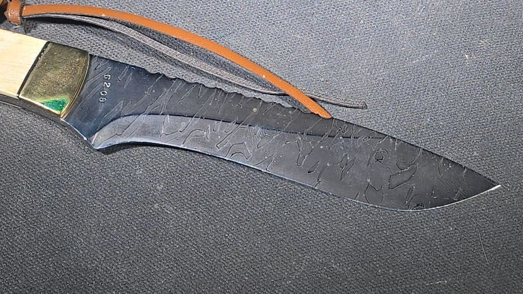 Vintage Damascus Steel Fixed-Blade Knife with Bone Handle, Brass Bolster, and Tooled Leather Sheath