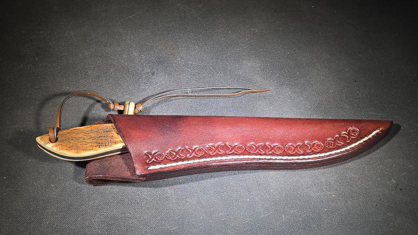 Vintage Damascus Steel Fixed-Blade Knife with Bone Handle, Brass Bolster, and Tooled Leather Sheath