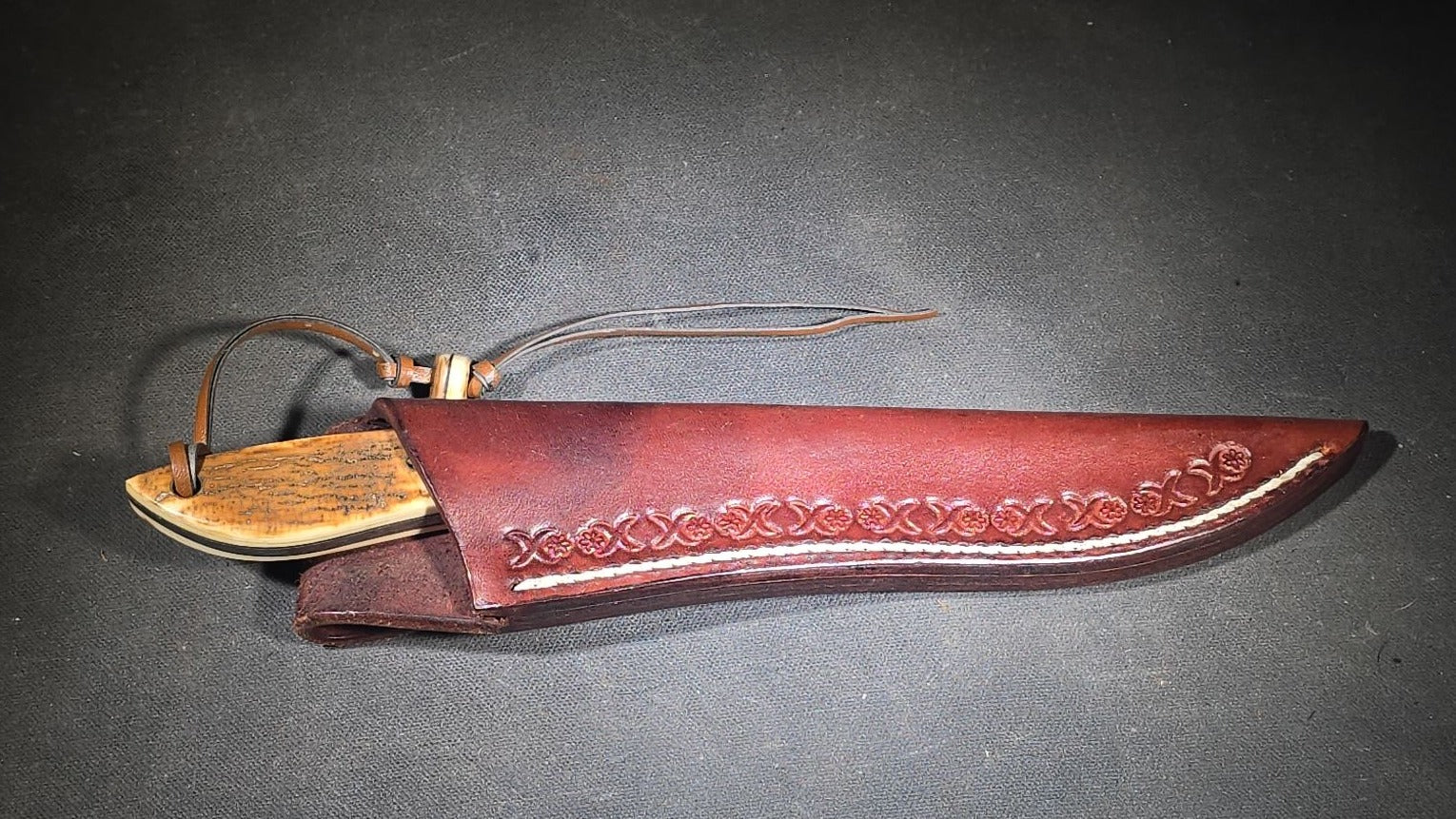 Vintage Damascus Steel Fixed-Blade Knife with Bone Handle, Brass Bolster, and Tooled Leather Sheath