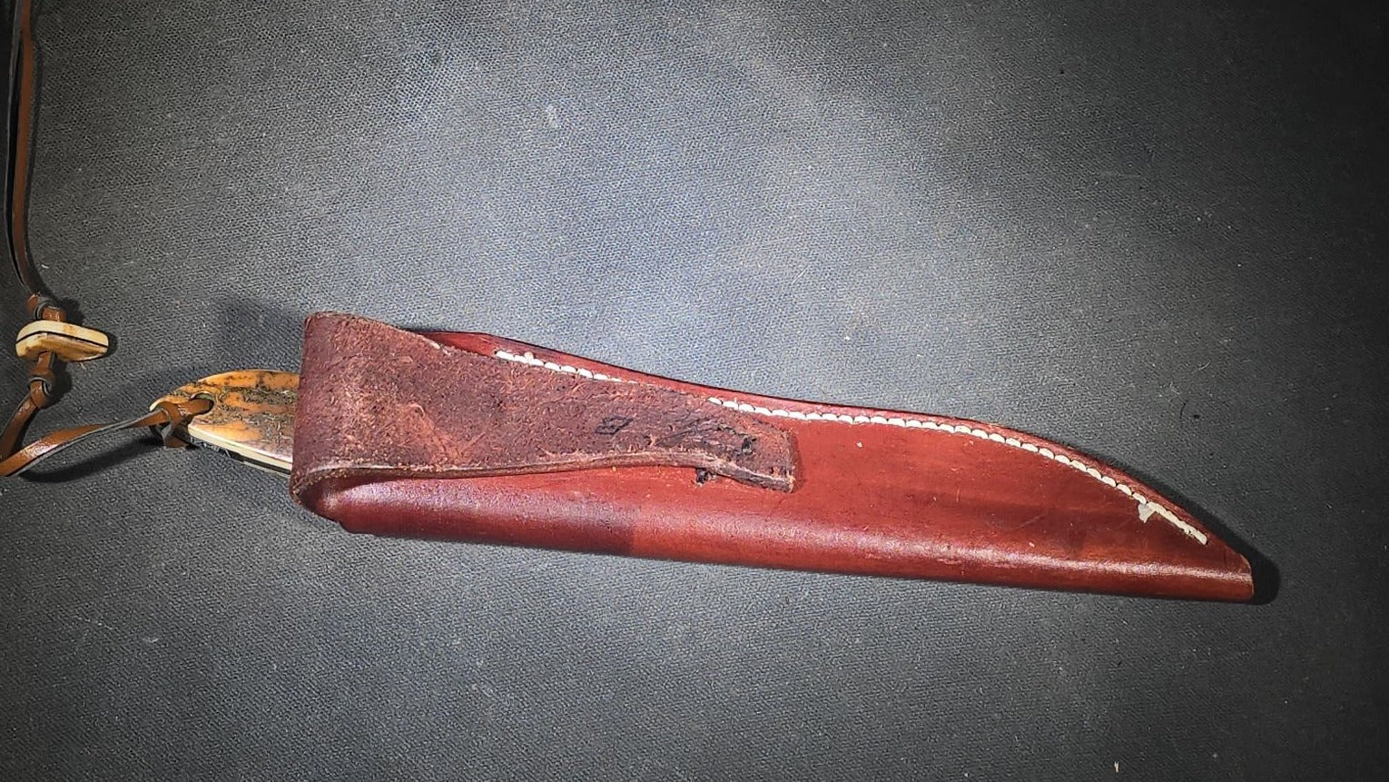 Vintage Damascus Steel Fixed-Blade Knife with Bone Handle, Brass Bolster, and Tooled Leather Sheath