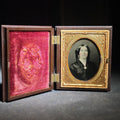 Lot 078 - Antique 1/9th Plate Ruby Ambrotype Photograph of a Young Woman with Hand-Tinted Cheeks in Thermoplastic Union Case, Photographed by Davis Brothers, Portsmouth, New Hampshire, 1859