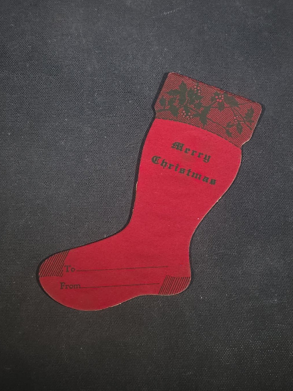 Grouping of Seven Antique and Vintage Christmas Ephemera including Santa Claus with Children in Sleigh R.P.P.C., Quincy Savings Bank Die-Cut Stocking Dime Holder, Personal Finance Company Advertising Needle Case, and Anti-New Deal Humorous Poem