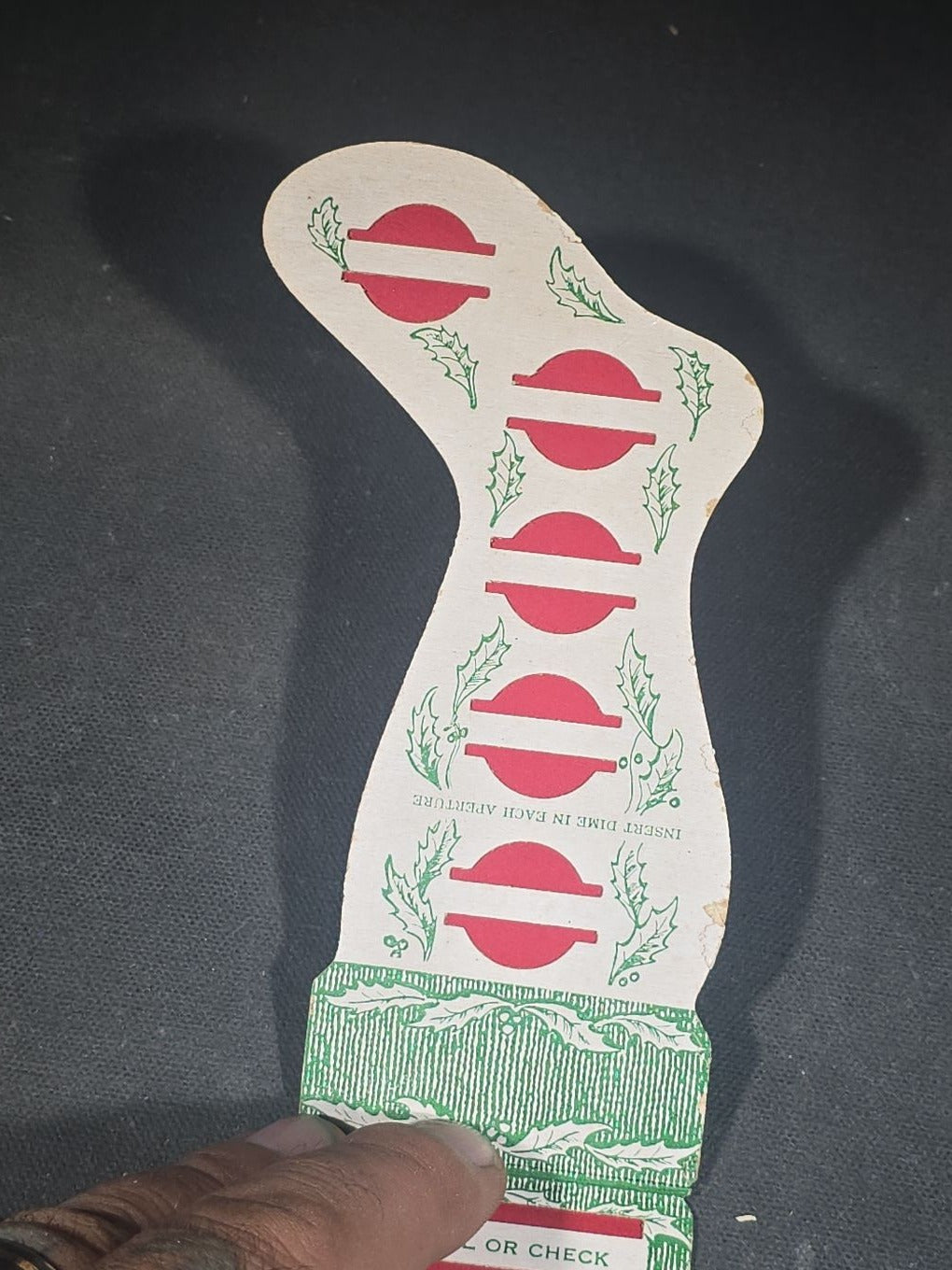 Grouping of Seven Antique and Vintage Christmas Ephemera including Santa Claus with Children in Sleigh R.P.P.C., Quincy Savings Bank Die-Cut Stocking Dime Holder, Personal Finance Company Advertising Needle Case, and Anti-New Deal Humorous Poem