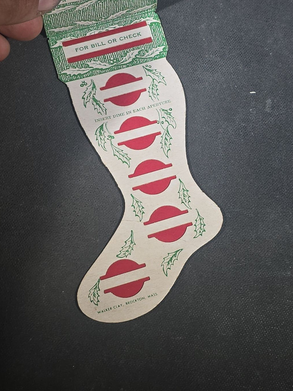 Grouping of Seven Antique and Vintage Christmas Ephemera including Santa Claus with Children in Sleigh R.P.P.C., Quincy Savings Bank Die-Cut Stocking Dime Holder, Personal Finance Company Advertising Needle Case, and Anti-New Deal Humorous Poem