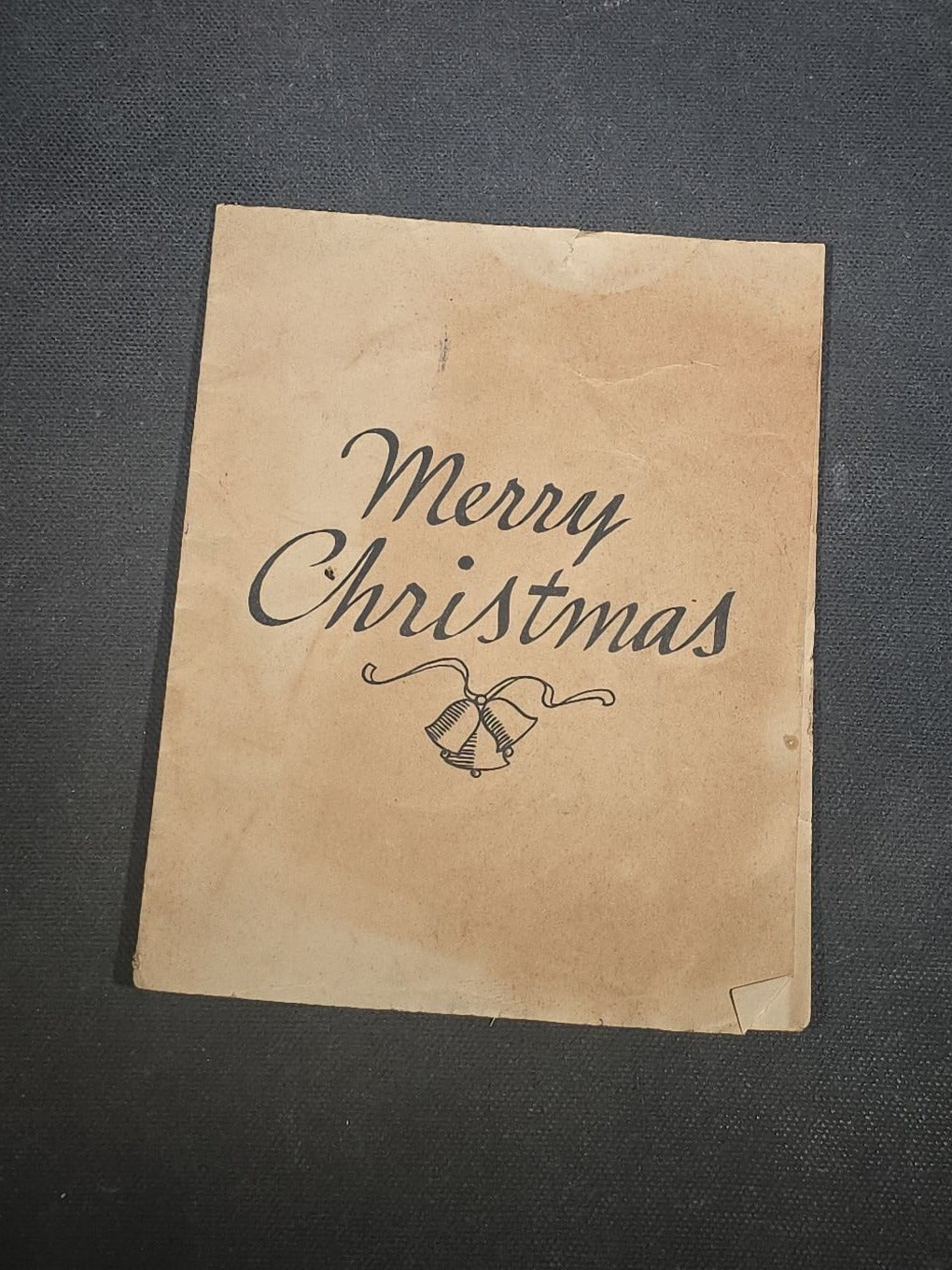 Grouping of Seven Antique and Vintage Christmas Ephemera including Santa Claus with Children in Sleigh R.P.P.C., Quincy Savings Bank Die-Cut Stocking Dime Holder, Personal Finance Company Advertising Needle Case, and Anti-New Deal Humorous Poem
