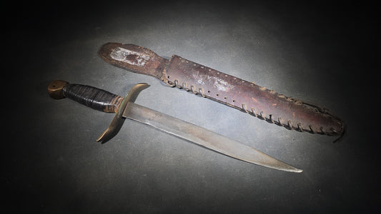 Vintage Bowie-Style Fighting Knife with Stacked Leather Grip, Brass Crossguard and Pommel, and Leather Sheath