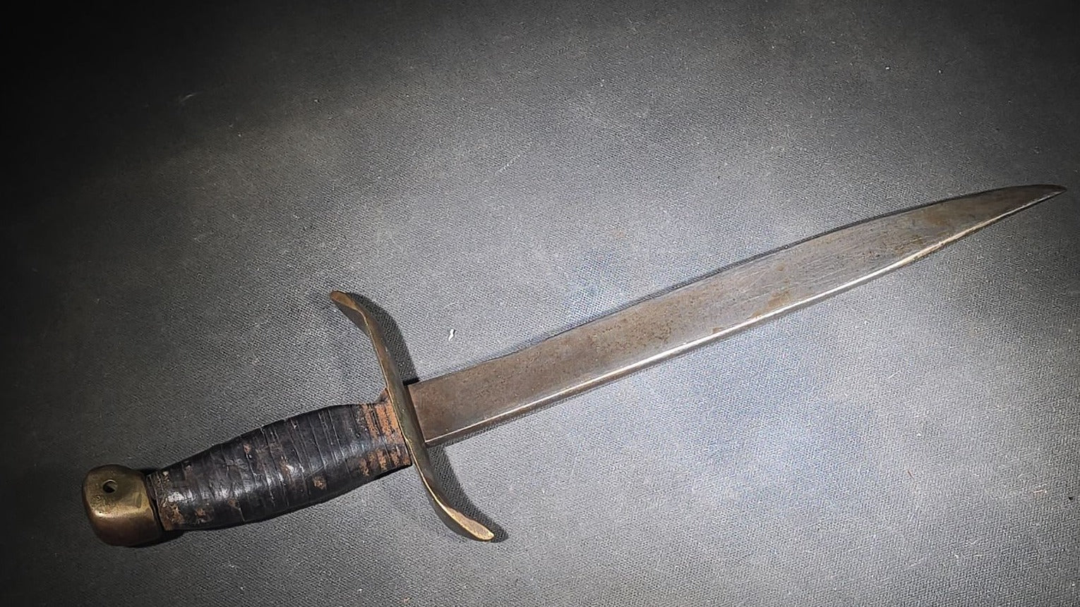 Vintage Bowie-Style Fighting Knife with Stacked Leather Grip, Brass Crossguard and Pommel, and Leather Sheath