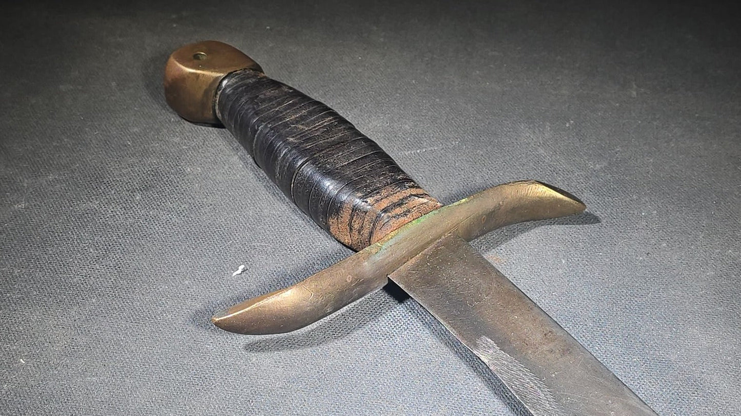 Vintage Bowie-Style Fighting Knife with Stacked Leather Grip, Brass Crossguard and Pommel, and Leather Sheath