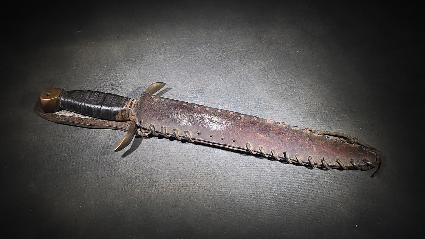 Vintage Bowie-Style Fighting Knife with Stacked Leather Grip, Brass Crossguard and Pommel, and Leather Sheath