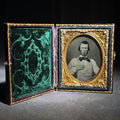 Lot 079 - Antique 1/9th Plate Ruby Ambrotype Photograph of a Young Man in Checked Vest and Bow Tie in Full Leatherette Case