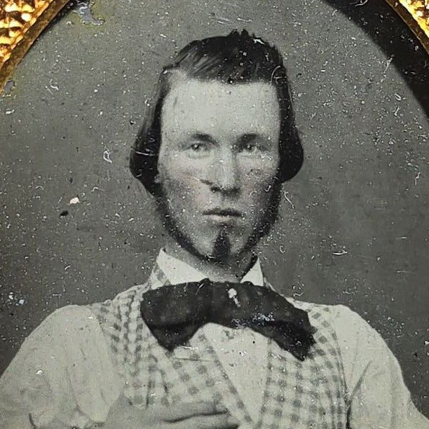 Antique 1/9th Plate Ruby Ambrotype Photograph of a Young Man in Checked Vest and Bow Tie in Full Leatherette Case