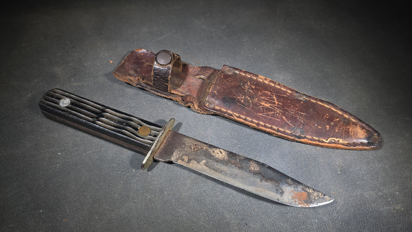 Vintage Fixed-Blade Knife with Grooved Handle and Leather Sheath