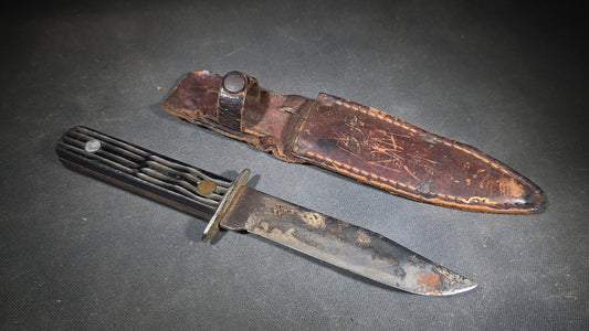 Vintage Fixed-Blade Knife with Grooved Handle and Leather Sheath