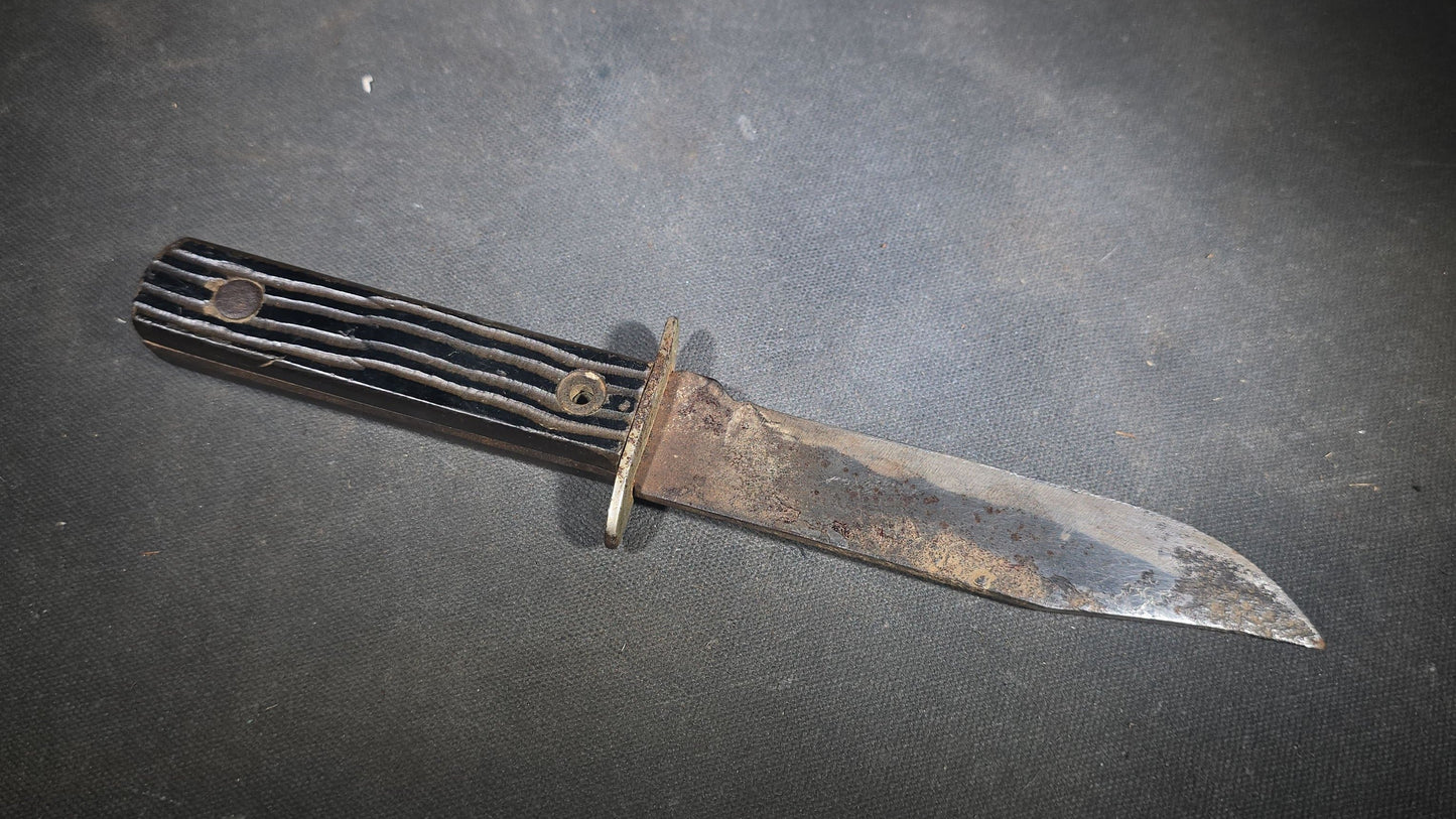 Vintage Fixed-Blade Knife with Grooved Handle and Leather Sheath