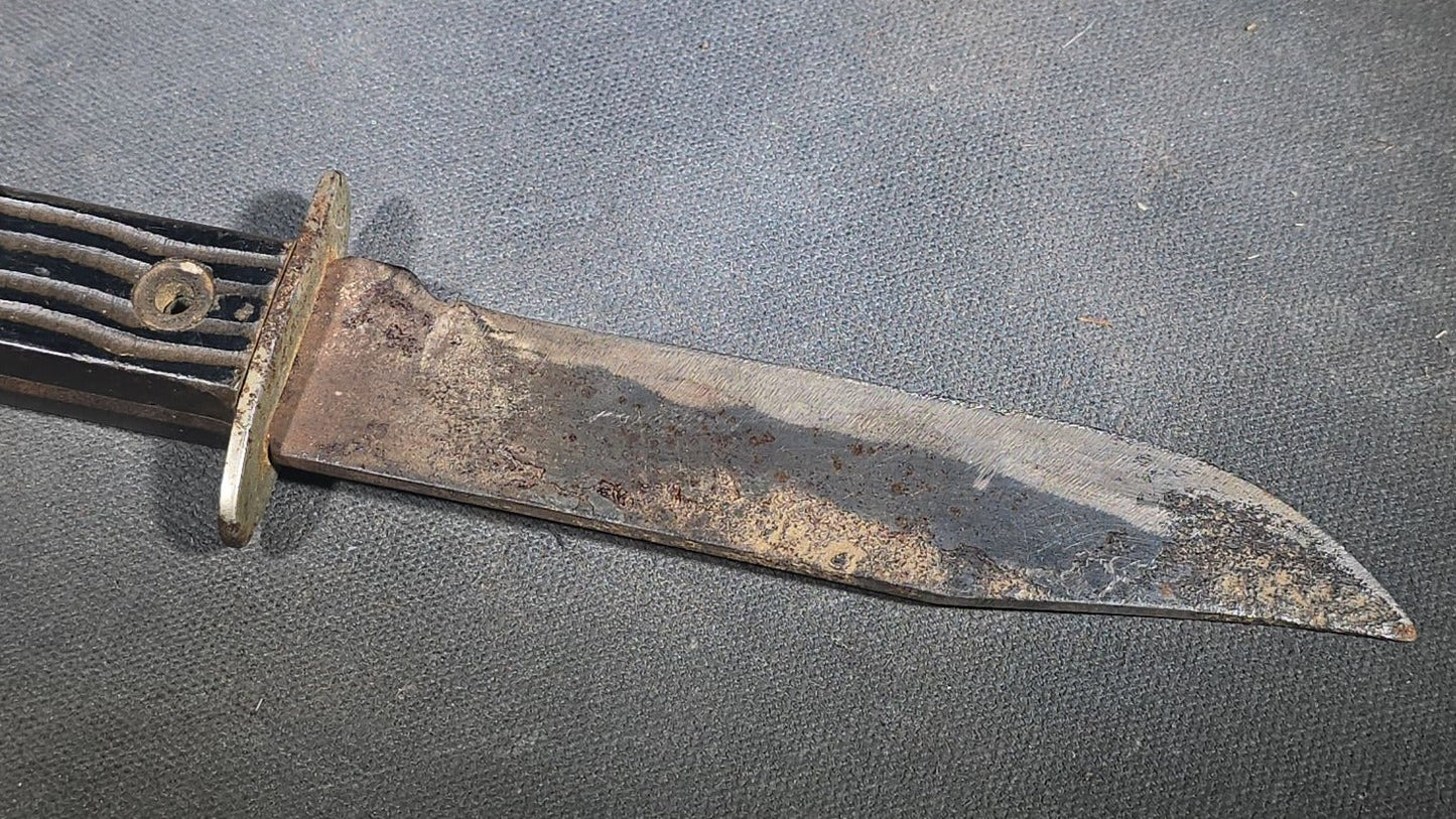 Vintage Fixed-Blade Knife with Grooved Handle and Leather Sheath