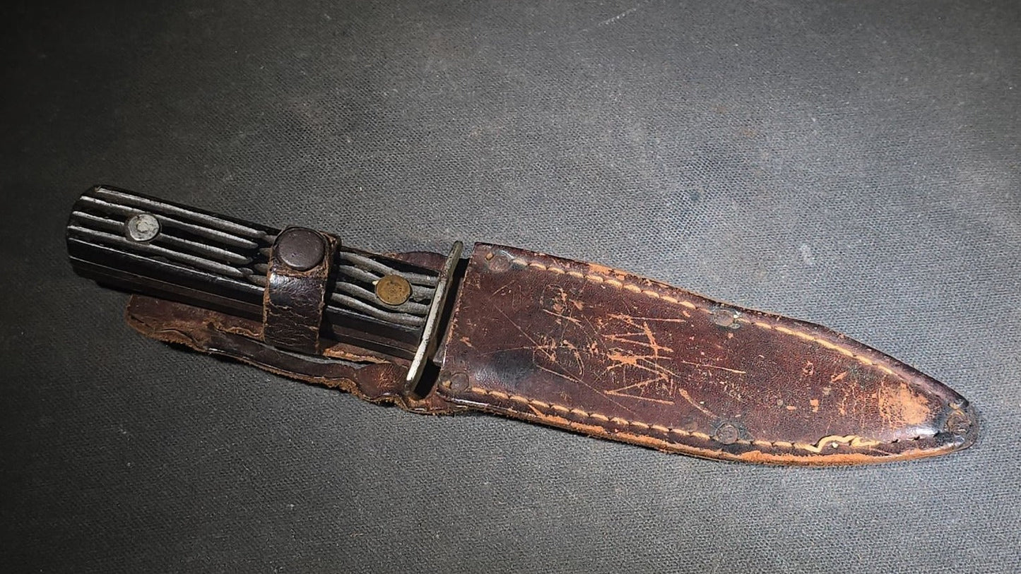 Vintage Fixed-Blade Knife with Grooved Handle and Leather Sheath