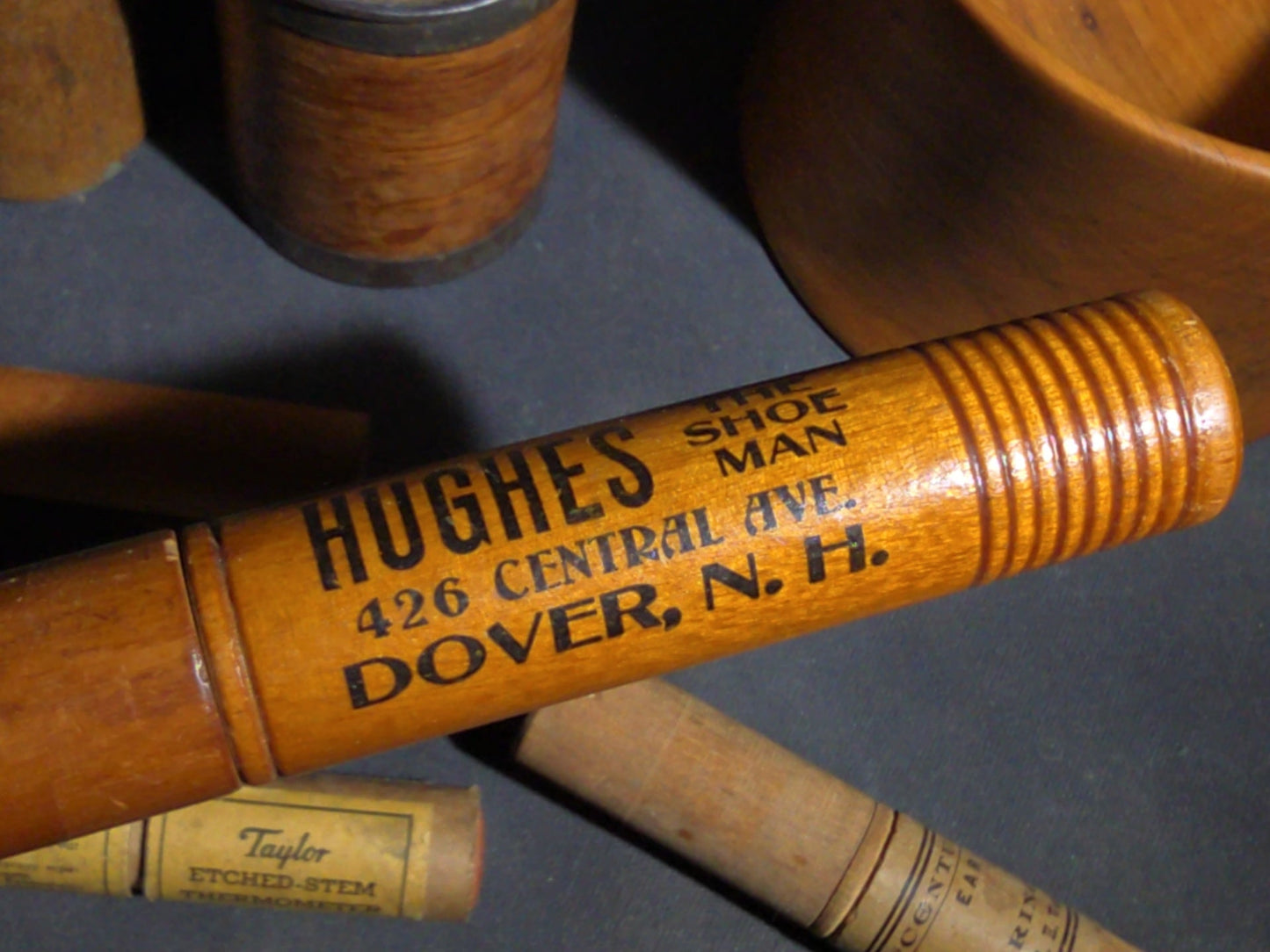 Grouping of Eight Antique, Vintage, and Modern Wooden Smalls Including Hughes "The Shoe Man" Advertising Shoehorn from Dover, New Hampshire, Turned Bowl Signed Jason Szafranski, Taylor Etched-Stem Thermometer, and "Century" Ear Syringe Case